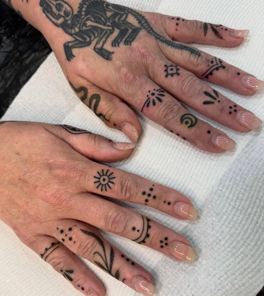 Small Tribal Animal on Women Fingers Tattoo by @estelletattoos