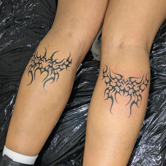 Small Tribal Butterfly Wings on Women Legs Tattoo by @elstattoos