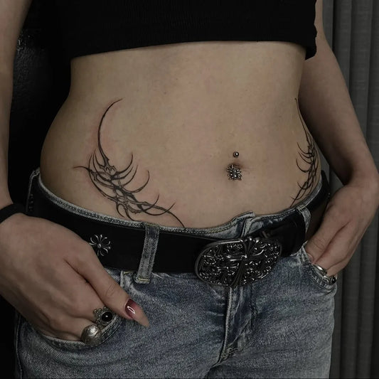 Small Tribal Curved Vines on Women Hip Tattoo by @killa.tattoo