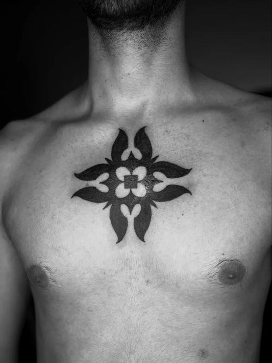Small Tribal Floral Cross on Men Chest Tattoo by @hends_dyak