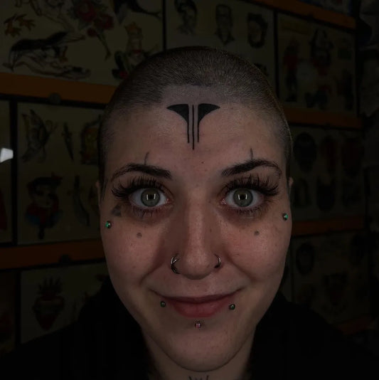 Small Tribal Tribal Marks on Women Face Tattoo by @medranotattoos