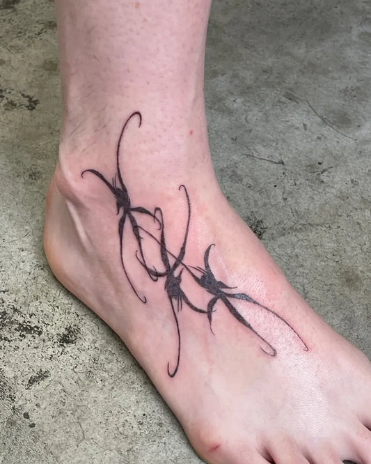 Small Tribal Vine Tattoo on Women Foot by @locke.jaw.maria