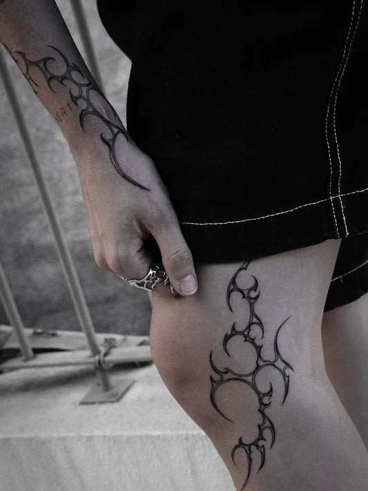 Small Tribal Vines on Women Arm and Thigh Tattoo by @maryrain.tattoo