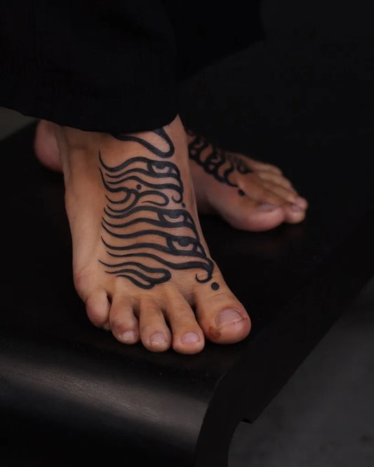 Small Tribal Wavy Lines on Men Foot Tattoo by @cmpll_ttt