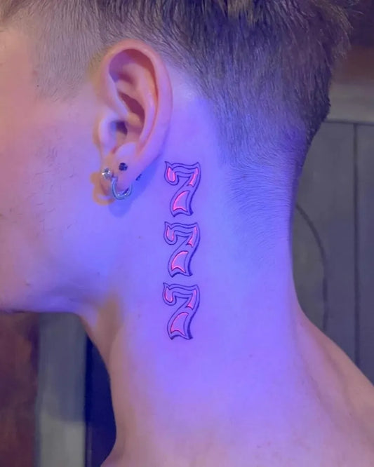 Small UV 777 Tattoo on Men Behind the Ear by @goldeniron_tattoos_toronto