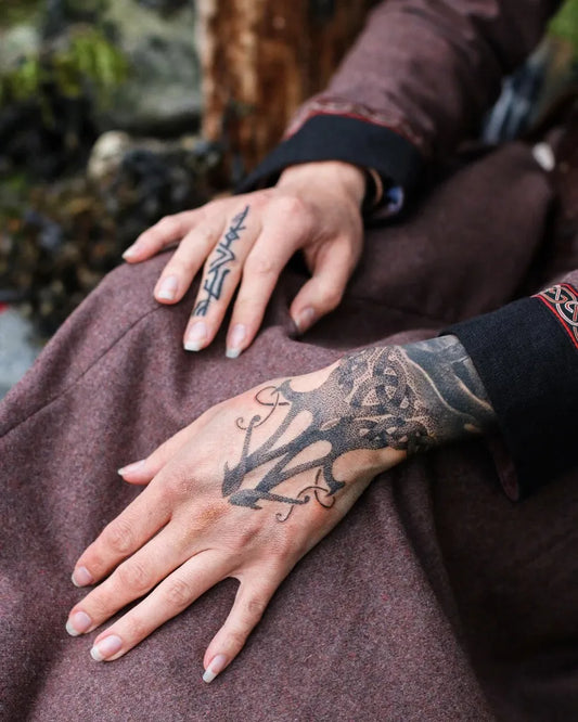 Small Viking anchor and tree on Women hands Tattoo by @skadi_of_mayhem