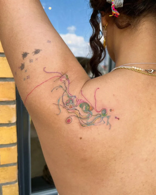 Small Watercolor Abstract Tentacles Tattoo on Women Shoulder by @zusam.ttt