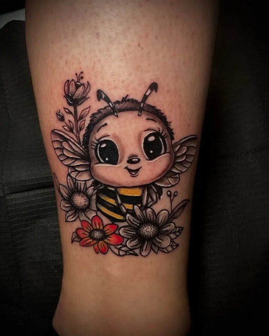 Small Watercolor Bee with Flowers on Women Ankle Tattoo by @kimthetattooist