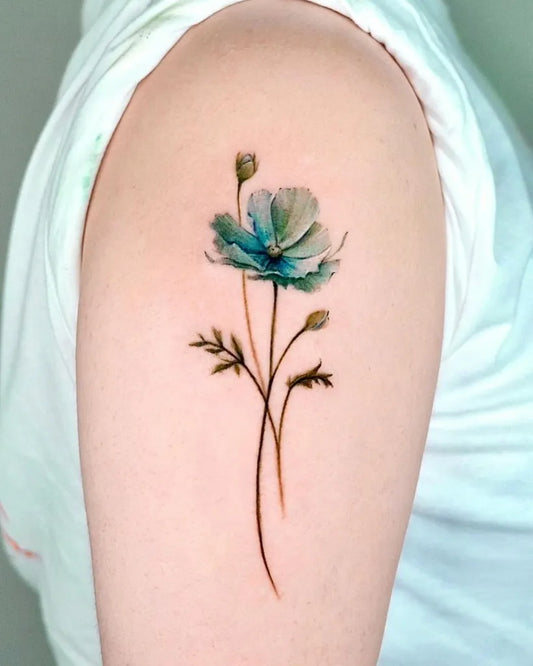 Small Watercolor Blue Poppy Flower with Buds and Stems on Women Shoulder Tattoo by @tattooist_rara