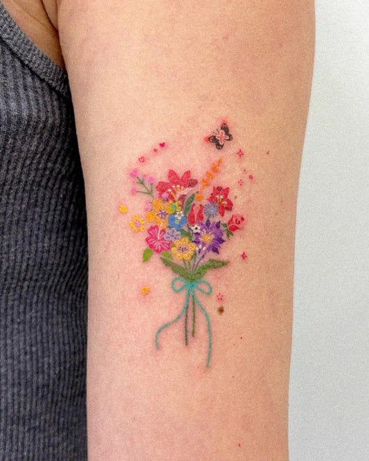 Small Watercolor Bouquet with Butterfly and Stars on Women Arm Flower Tattoo by @gimmechuru