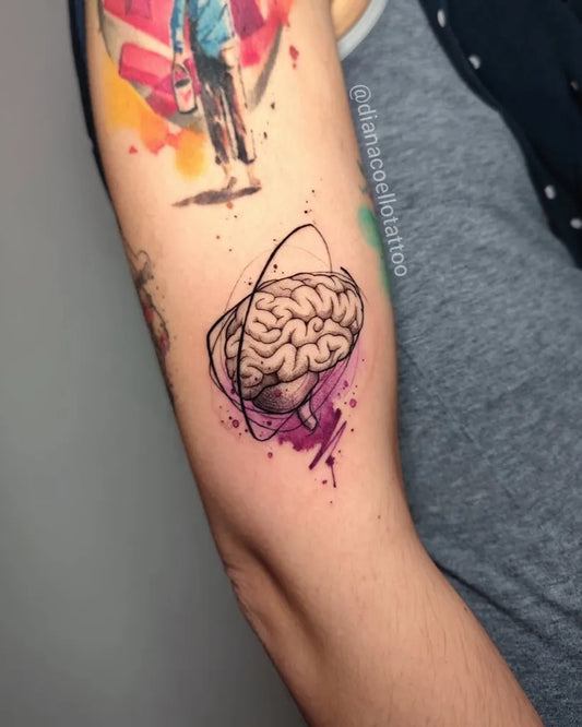 Small Watercolor Brain with Orbit Men Arm Tattoo by @dianacoellotattoo