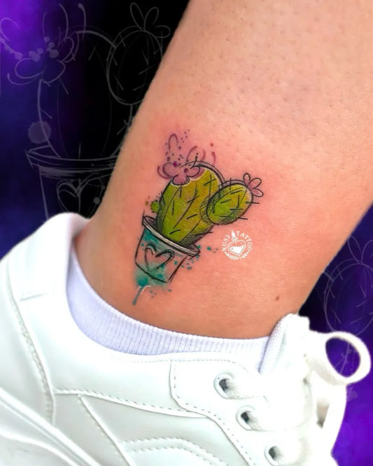 Small Watercolor Cactus and Flower Tattoo on Women Ankle by @nusytattoo