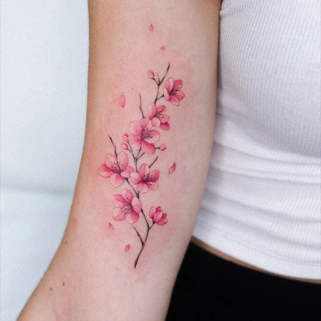 Small Watercolor Cherry Blossom on Women Arm Tattoo by @tattooer_nina