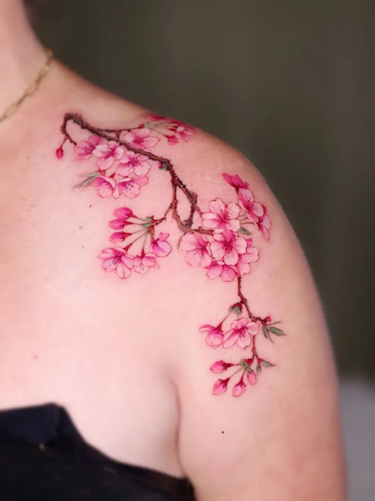 Small Watercolor Cherry Blossom on Women Shoulder Tattoo by @tiantian_tattooist