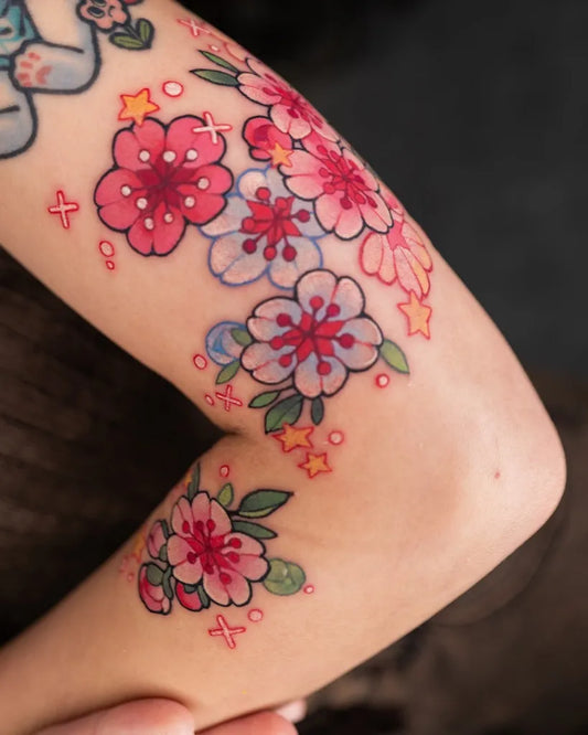 Small Watercolor Cherry Blossoms and Stars on Women Arm Tattoo by @bellesea_