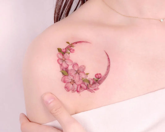 Small Watercolor Crescent Moon with Cherry Blossoms Tattoo on Women Collarbone by @peria_tattoo