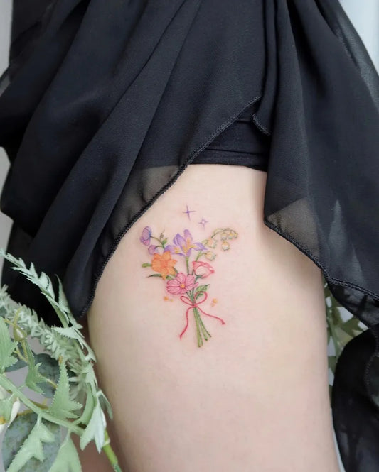 Small Watercolor Daffodil Bouquet Tattoo on Women Thigh by @mini.b_tats