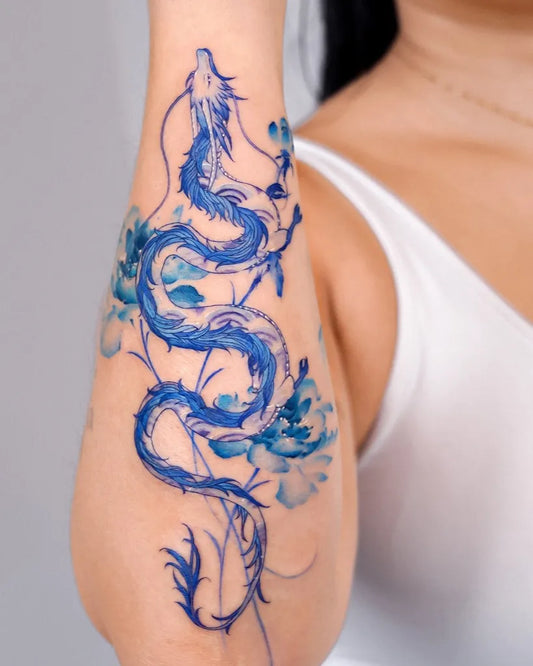 Small Watercolor Dragon and Lotus on Women Arm Tattoo by @e.nal.tattoo