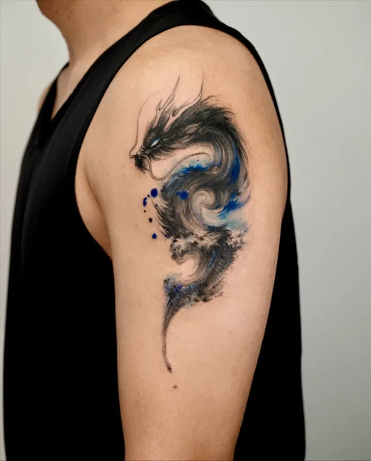 Small Watercolor Dragon on Men Arm Tattoo by @sansa.jr.tattoo