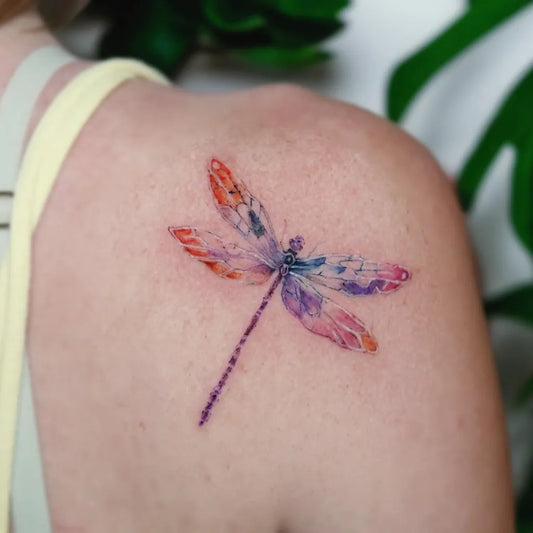 Small Watercolor Dragonfly on Women Shoulder Tattoo by @tattooist_river