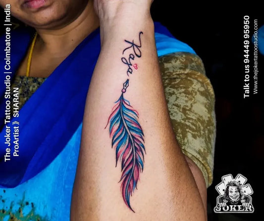 Small Watercolor Feather Tattoo on Women Wrist by @thejokertattoostudio