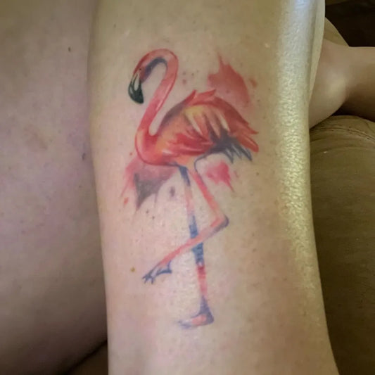 Small Watercolor Flamingo Tattoo on Women Leg by @lottie_lou5