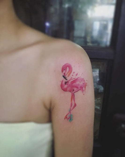 Small Watercolor Flamingo Tattoo on Women Shoulder by @pongrerocktattoo