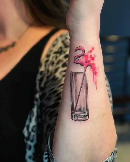 Small Watercolor Flamingo and Dripping Glass Tattoo on Women Wrist by @tattoologylounge