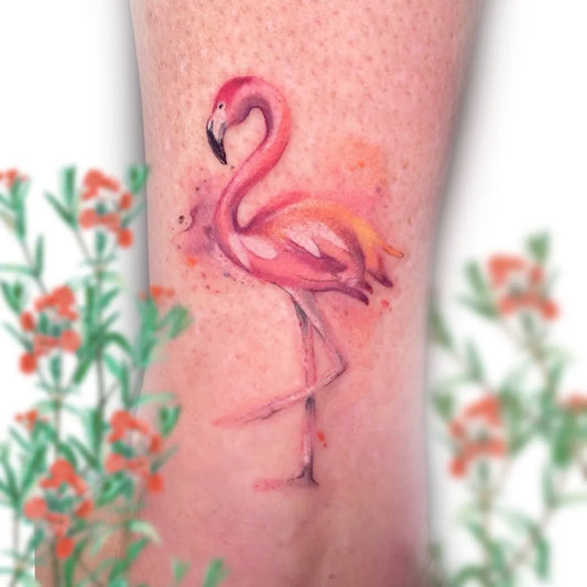 Small Watercolor Flamingo and Flowers Tattoo on Women Leg by @gata_negra_tattoo