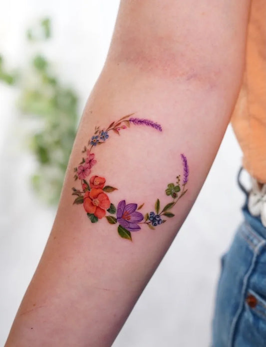 Small Watercolor Flower Wreath on Women Arm Tattoo by @benideboyasana