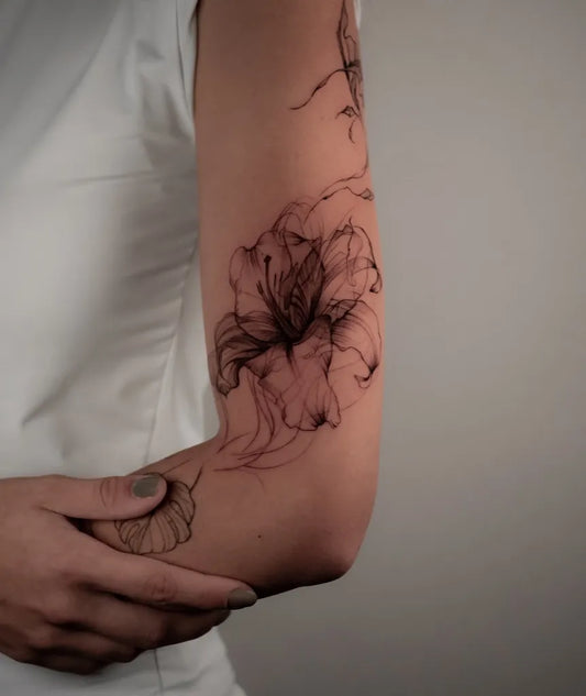 Small Watercolor Hibiscus and Vines on Women Arm Flower Tattoo by @onur.kolev