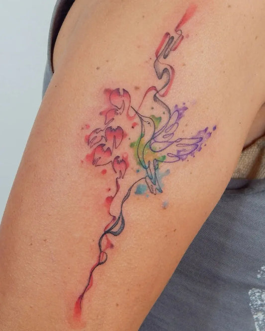 Small Watercolor Hummingbird and Flowers on Women Upper Arm Tattoo by @adrielmazzeotattoo