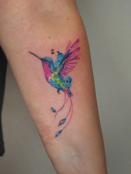 Small Watercolor Hummingbird on Women Arm Tattoo by @babie_lato_tattoo