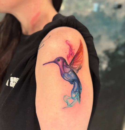 Small Watercolor Hummingbird on Women Shoulder Tattoo by @ghostinkcompany