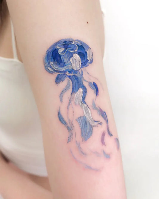Small Watercolor Jellyfish Tattoo on Women Arm by @chanmi_gallery