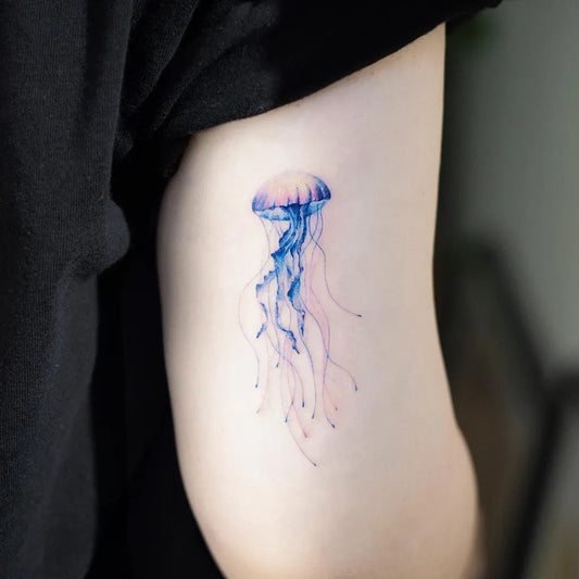 Small Watercolor Jellyfish Tattoo on Women Arm by @pokhy_tattoo