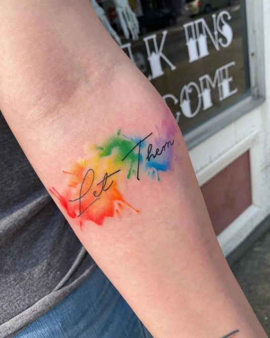 Small Watercolor Let Them on Women Arm Tattoo by @magpiemorely