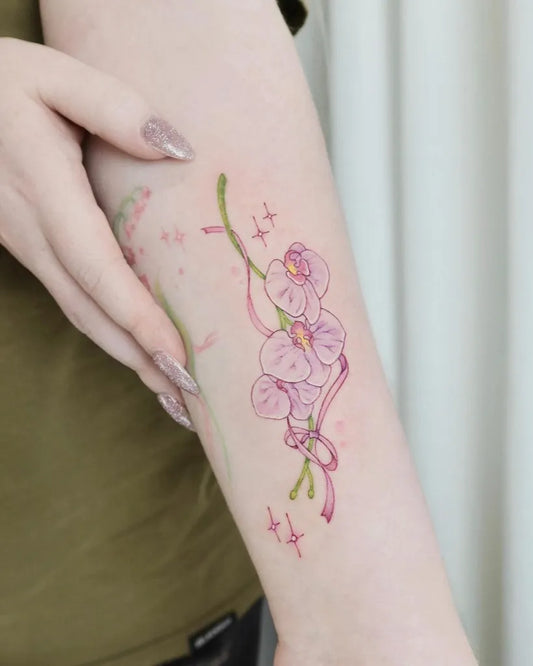 Small Watercolor Lily of the Valley Orchid Vines on Women Arm Tattoo by @mini.b_tats