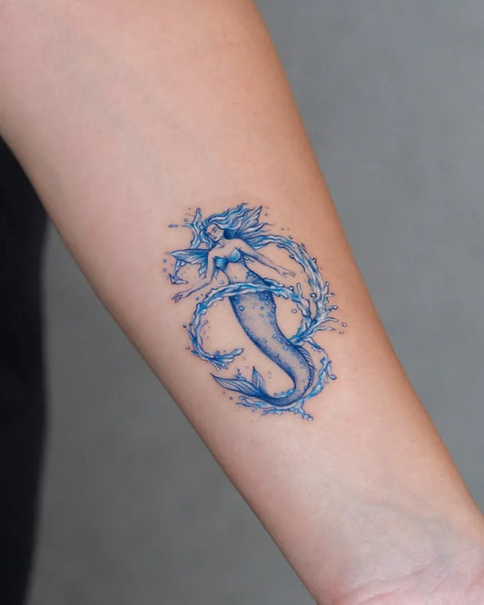 Small Watercolor Mermaid Tattoo on Women Arm by @yaseminyesilbag