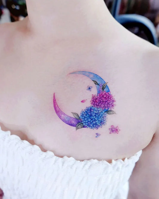 Small Watercolor Moon and Hydrangea Tattoo on Women Shoulder by @cheeu_tattoo