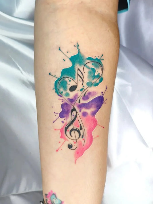 Small Watercolor Music Notes and Butterfly Splashes on Women Arm Tattoo by @remolachotattoo