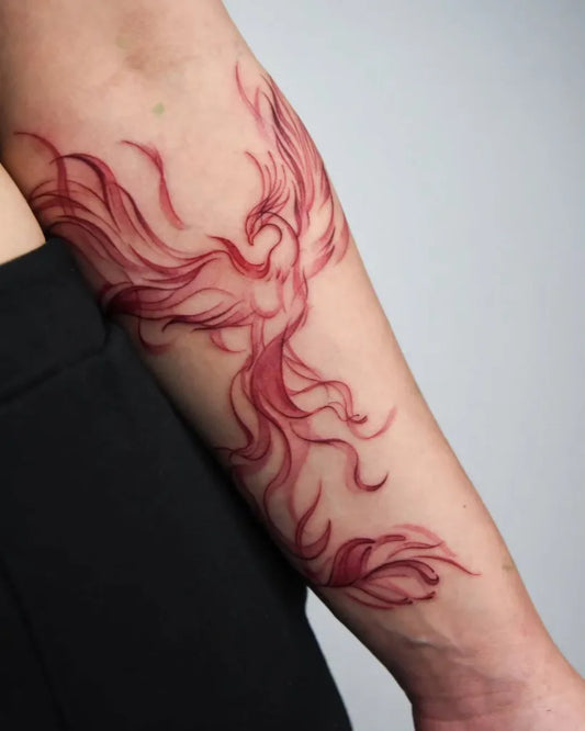 Small Watercolor Phoenix on Women Arm Tattoo by @_nono_tattoo