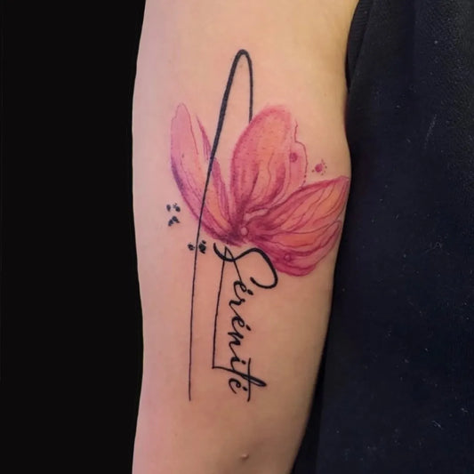 Small Watercolor Pink Flower with Serenity Text on Women Arm Tattoo by @shop.imagin