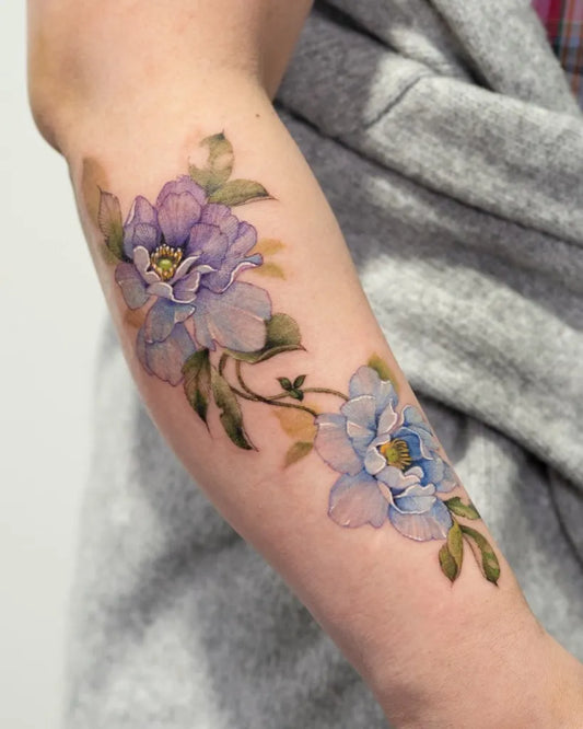 Small Watercolor Purple Flowers on Women Forearm Tattoo by @tattooist_silo