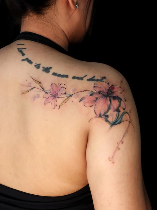 Small Watercolor Quote and Lilies on Women Shoulder Tattoo by @dukduk_chimm