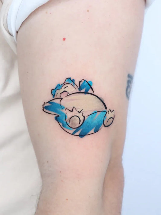 Small Watercolor Snorlax Pokemon Tattoo on Men Arm by @gil_miguel_tattoo_