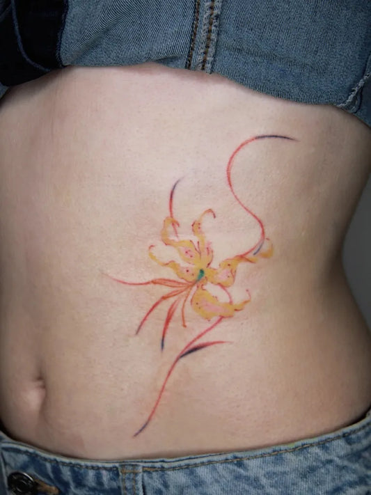 Small Watercolor Tiger Lily on Women Abdomen Flower Tattoo by @rue_havefun_tattoo