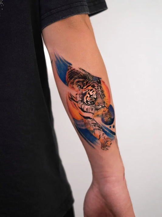 Small Watercolor Tiger and Planets on Men Arm Tattoo by @yesimkurtw