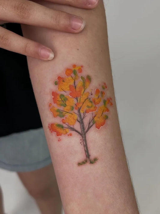 Small Watercolor Tree Tattoo on Women Arm by @tattoobahar