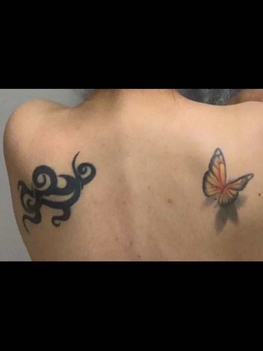 Small Watercolor Tribal Swirl and Monarch Butterfly on Women Back Tattoo by @chipperharbin